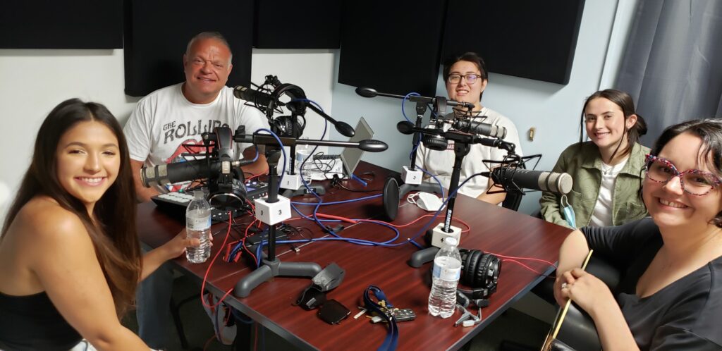 podcast hosts with guest and interns